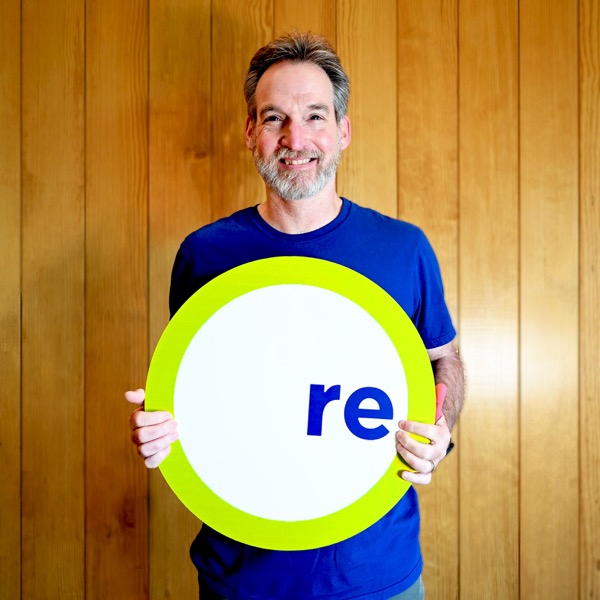 Ken, team member, holding a REdesign.build sign